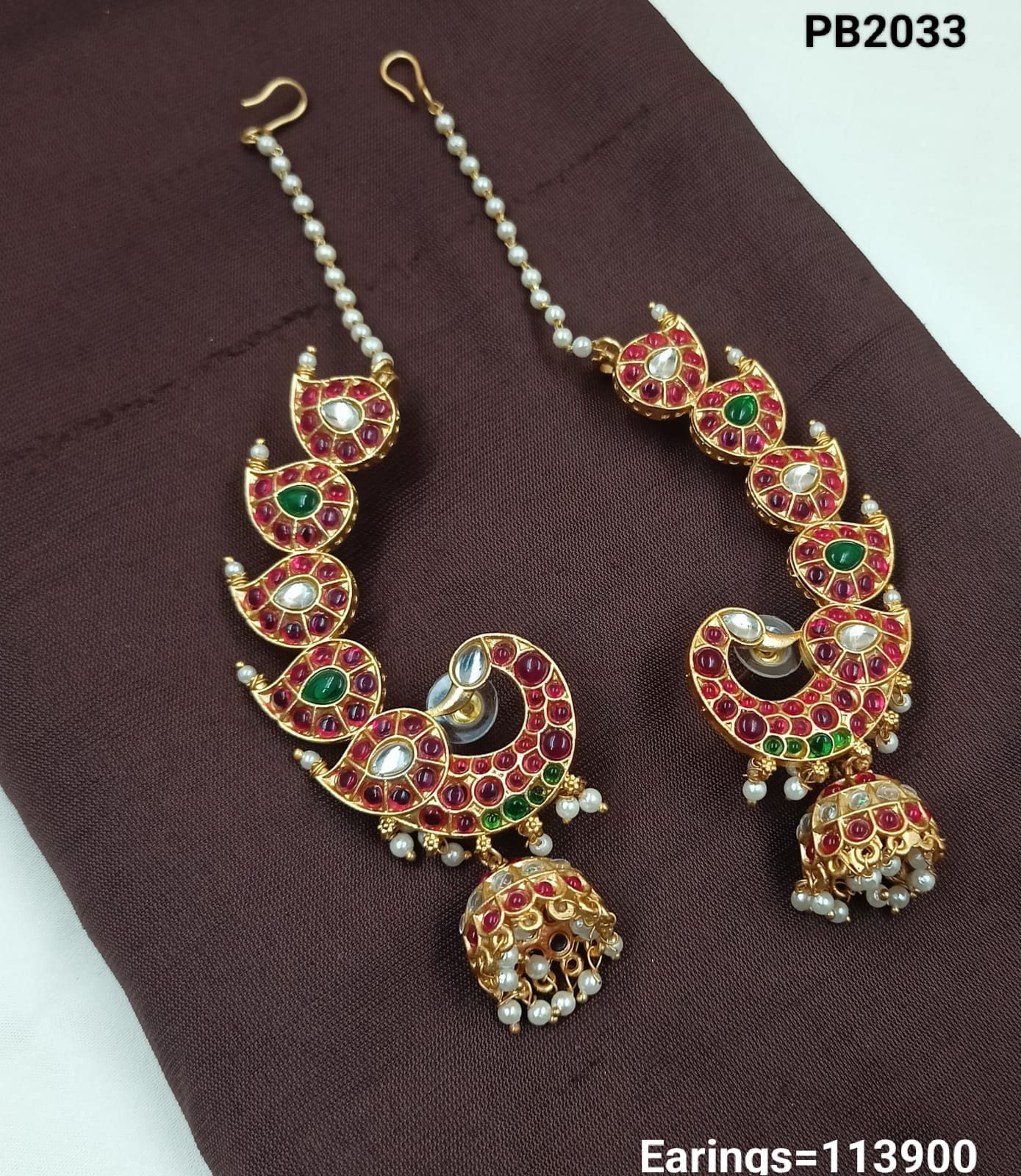Traditional Kundan Peacock Jhumka Earrings with Pearl Chain – Red & Green Enamel Finish